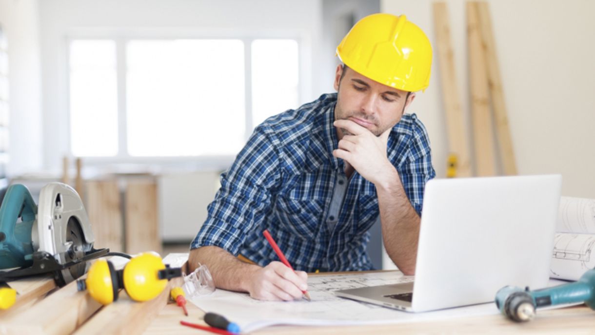 worker at desk with laptop